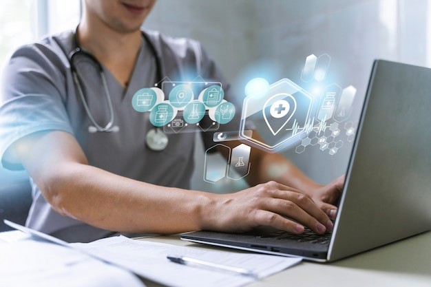 Healthcare professional using a laptop with digital healthcare icons representing HIPAA compliance and data security.