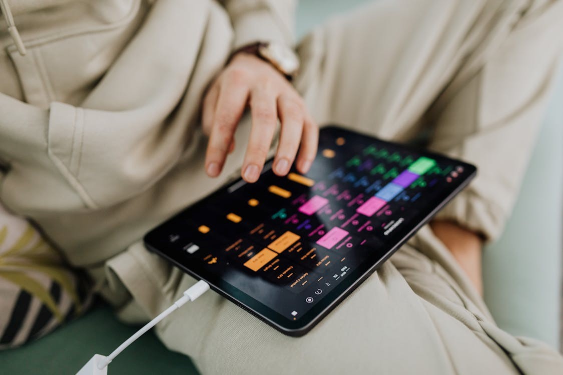 A person using black tablet computer