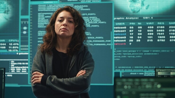 A professional woman confident in using detection methods for enhanced threat hunting.